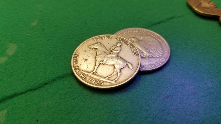 An early United States commemorative half dollar on green felt