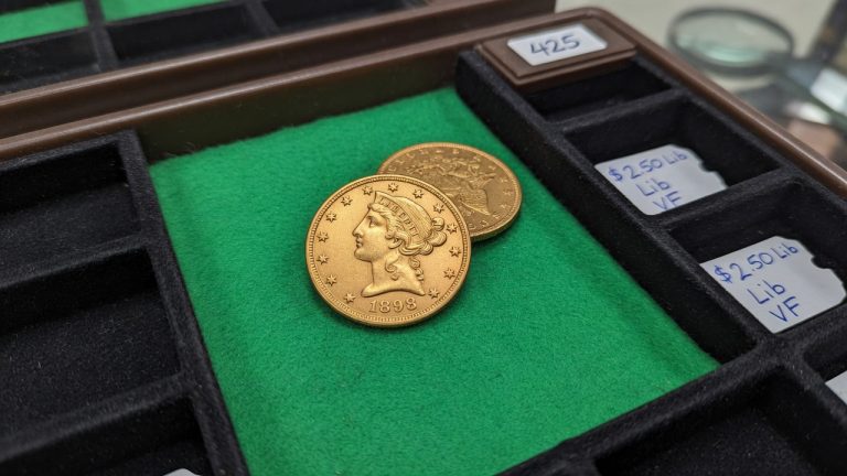 A United States $2.50 Liberty gold coin on green felt
